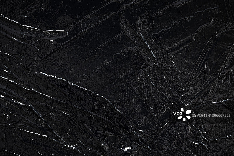 画布上黑色丙烯颜料特写图片素材