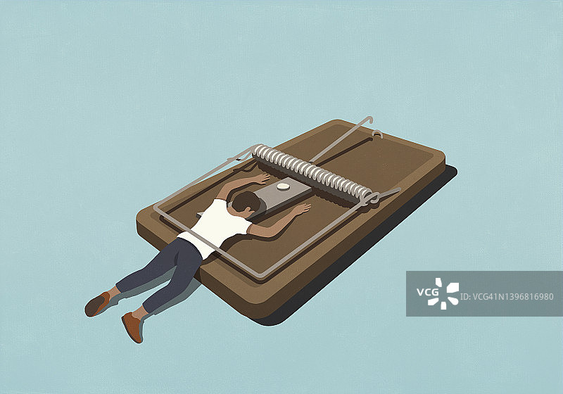 男子被困在老鼠夹中图片素材