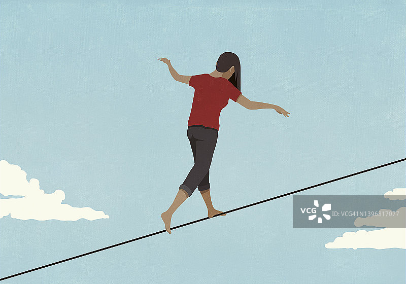 赤脚女子在空中走钢丝图片素材