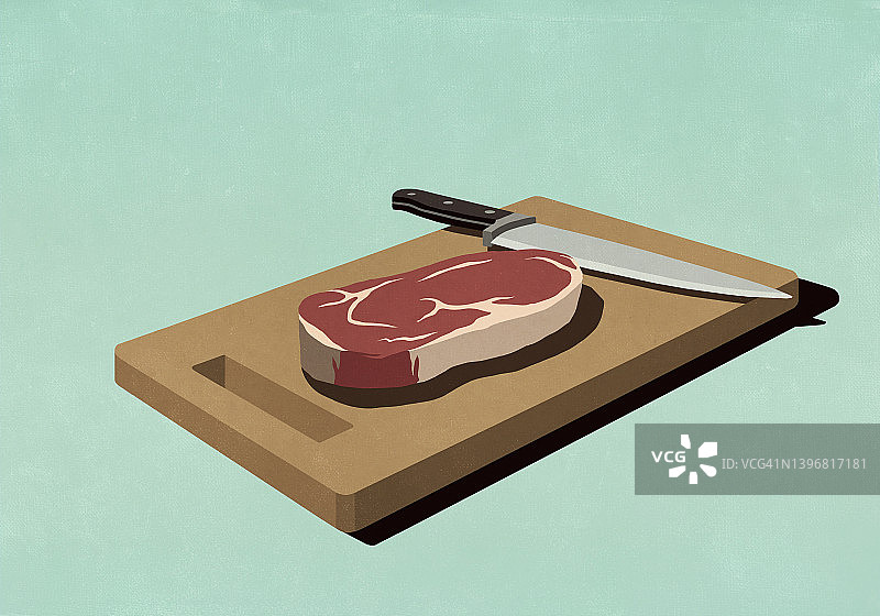 带刀的砧板生牛排图片素材