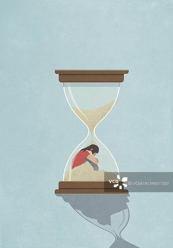 沙子落在沙漏里的女人身上图片素材