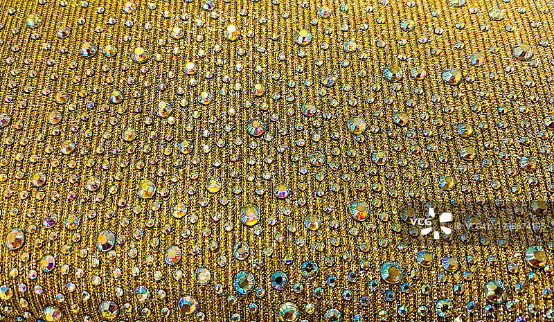 织物的精致金色珠饰图片素材