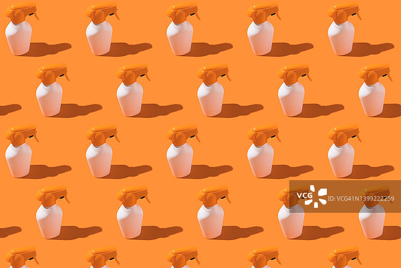 白色和橙色防晒霜喷雾瓶图案图片素材