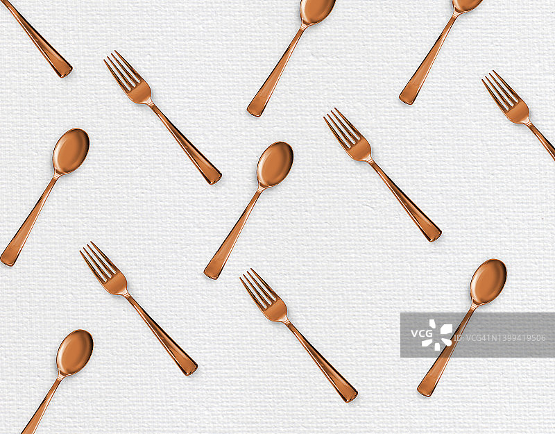 白色图案背景下的塑料餐叉、勺子和刀具图片素材