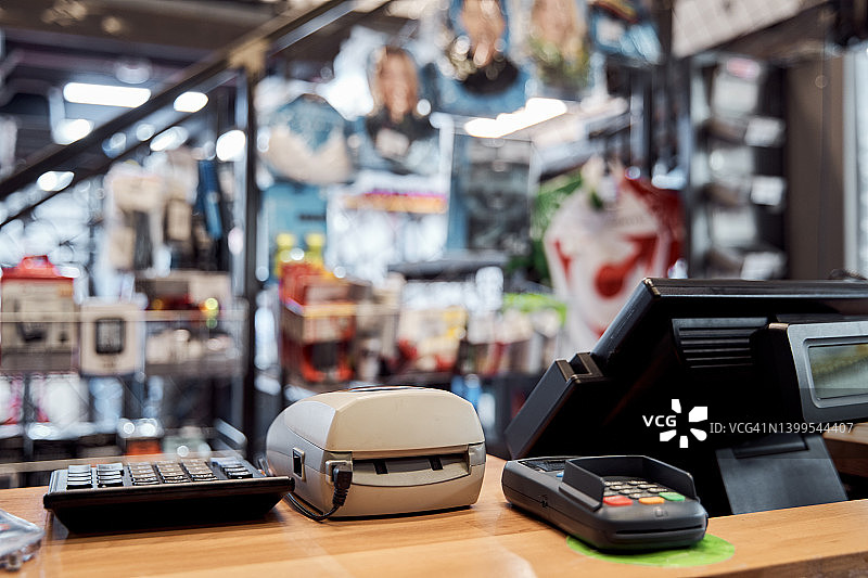 商店的背景。中小企业的概念。专注于密码键盘。图片素材