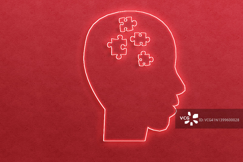 带有拼图块的头部-自闭症概念，红色霓虹灯图片素材
