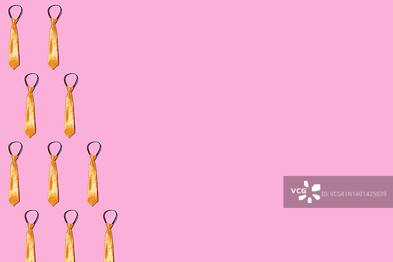 粉色背景上的金色黄色领带图案图片素材