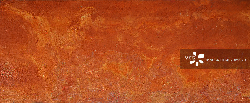 水泥墙上涂刷橙色油漆，灰色粗糙抽象表面纹理混凝土材料背景图片素材