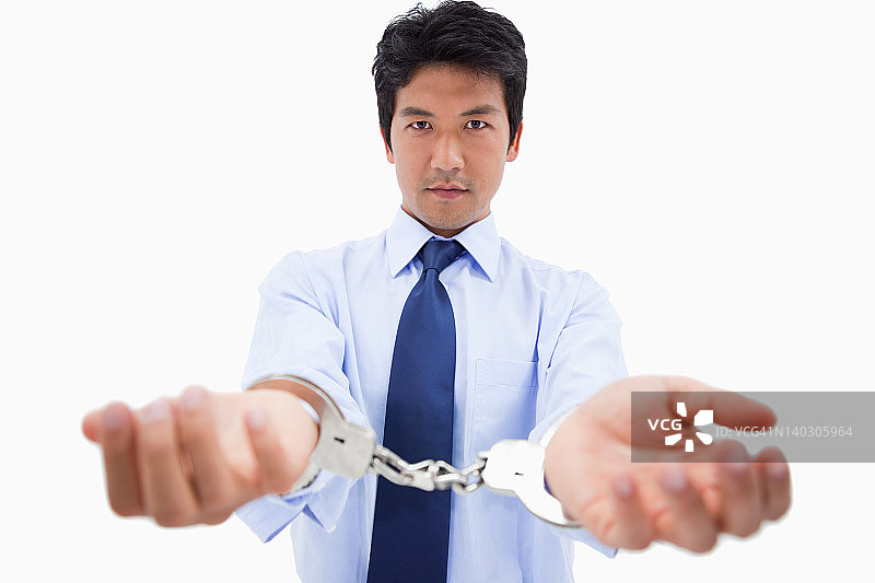 戴着手铐的商人图片素材