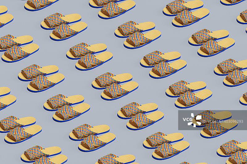 蓝色背景上的许多彩色沙滩人字拖，夏季概念图片素材