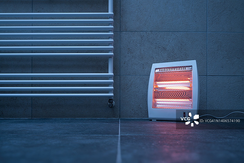 散热器旁的电红外加热器（石英加热器）图片素材