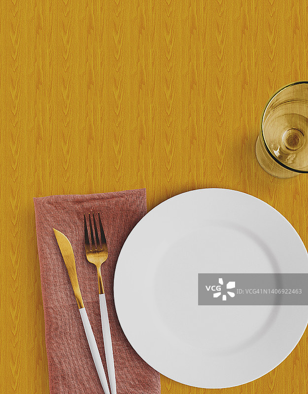 木桌上的餐盘刀叉餐具摆设图片素材