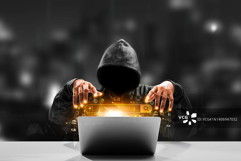 匿名黑客和恶意软件黑客在二进制代码背景上使用带有危险数字代码的笔记本电脑图片素材