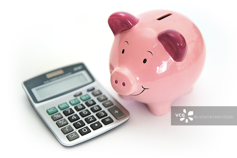 储蓄罐和计算器图片素材