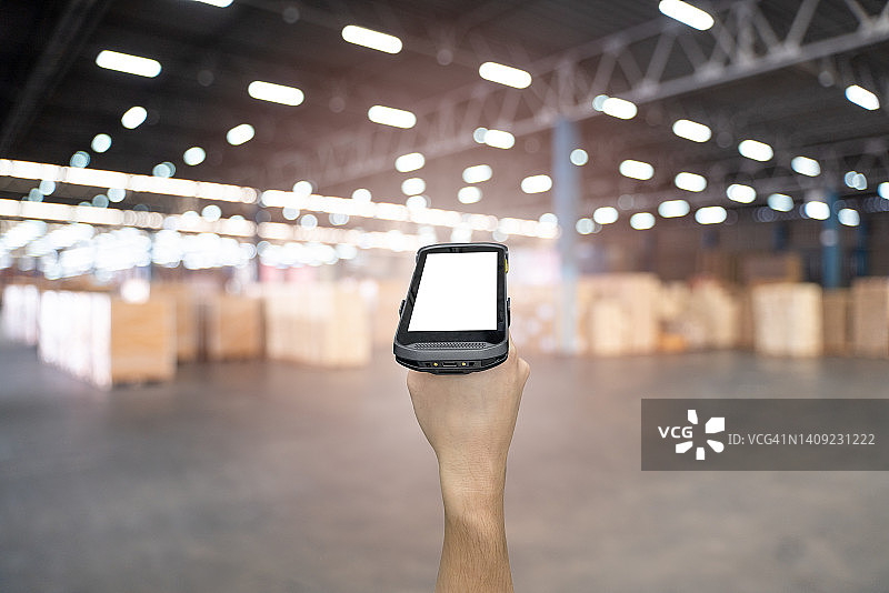 仓库中带有条形码扫描器的数字条形码扫描器图片素材