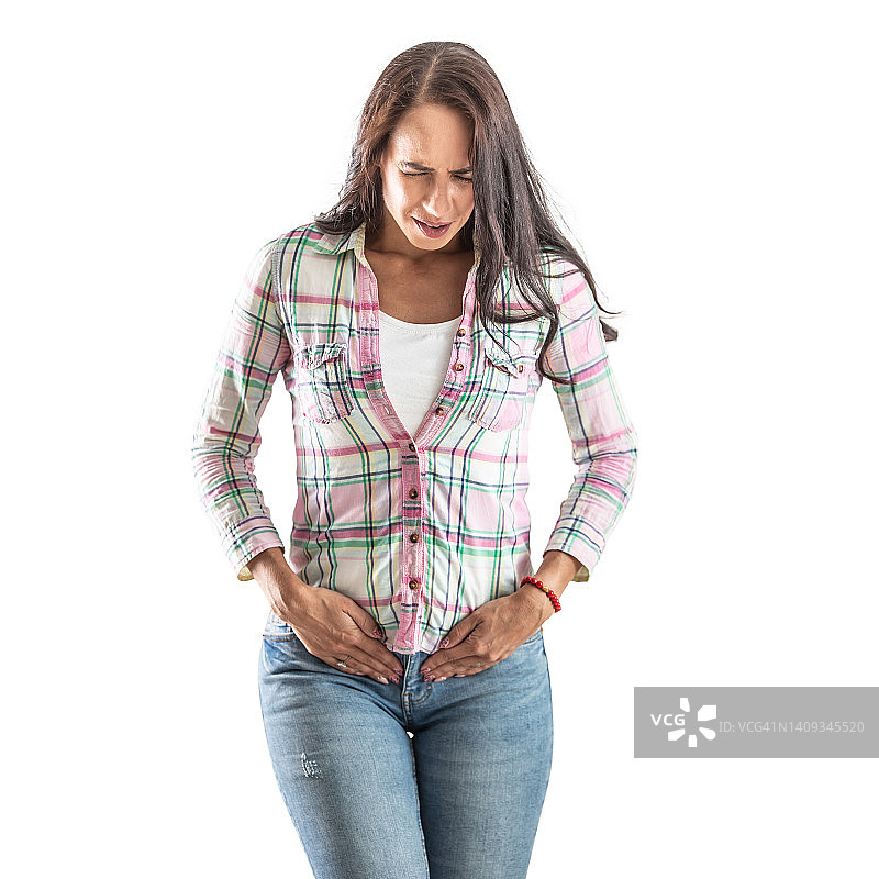 月经或排卵痛，一名女性因痛苦的痉挛而按住下腹部。隔离在白色背景上。图片素材