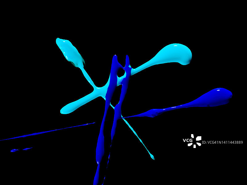 黑色背景上的蓝色丙烯颜料滴图片素材