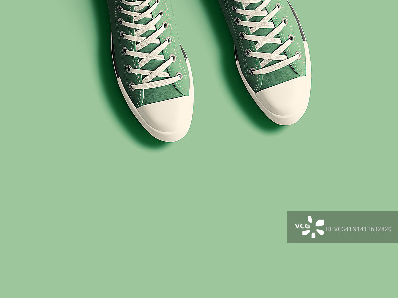 有文案空间的绿色运动鞋顶视图图片素材