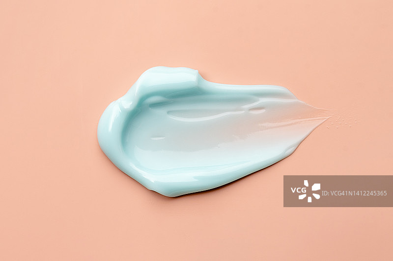 米色背景抗衰老润肤霜或身体乳纹理涂抹图片素材