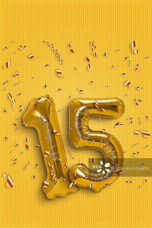 金色箔气球数字15和纸屑图片素材