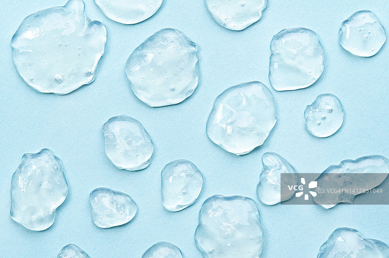 蓝色背景上的凝胶样品，科学实验室的化学研究，扁平风格微距摄影图片素材