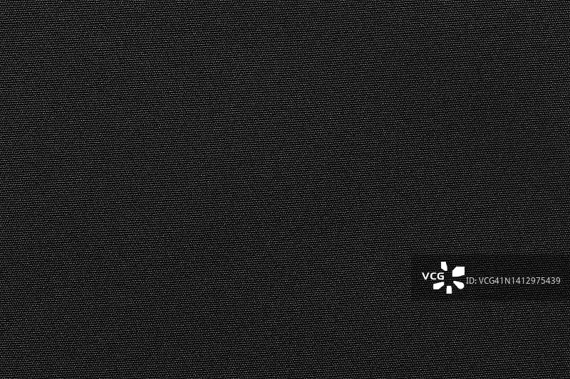 黑色色布布涤纶纹理和纺织品背景。图片素材