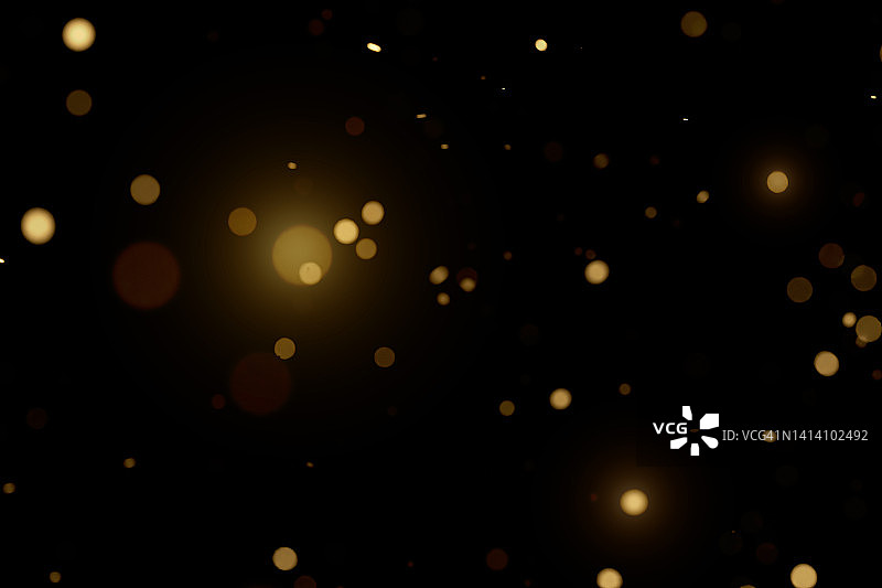 黑色背景上的金色模糊粒子节日背景图片素材