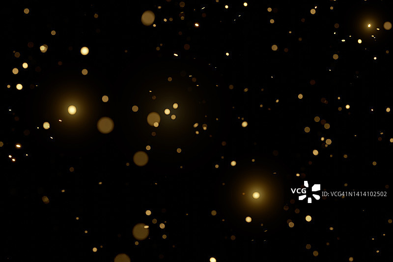 黑色背景上的模糊金色颗粒。节日背景。适合您设计的节日彩色背景。圣诞快乐，新年快乐图片素材