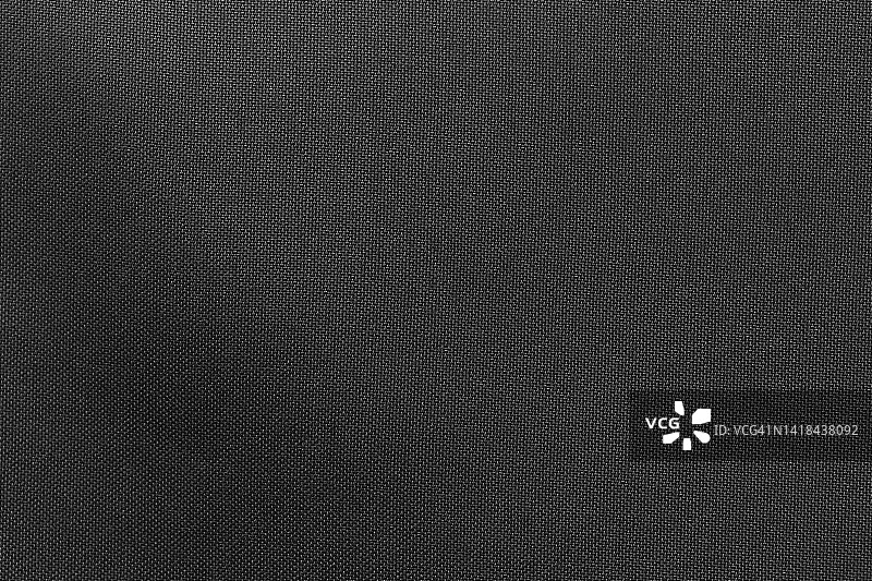 黑色色布布涤纶纹理和纺织品背景。图片素材