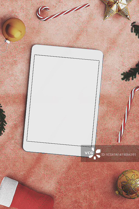 圣诞节物品和数码平板电脑俯视图红色背景图片素材