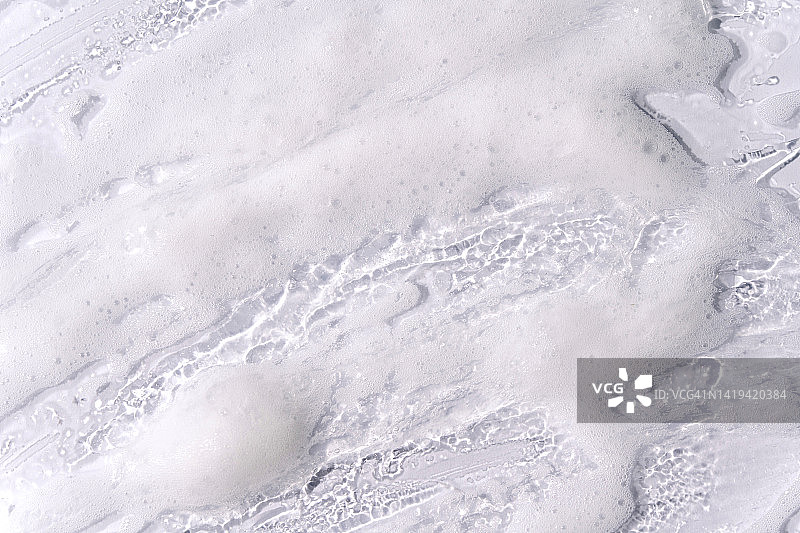 灰色背景上的纹理泡沫图片素材