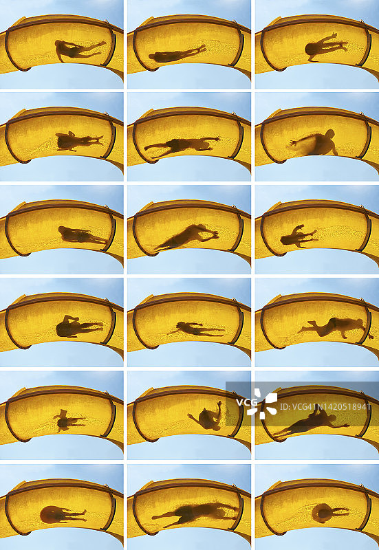 人们在黄色滑水道滑行的剪影图片素材