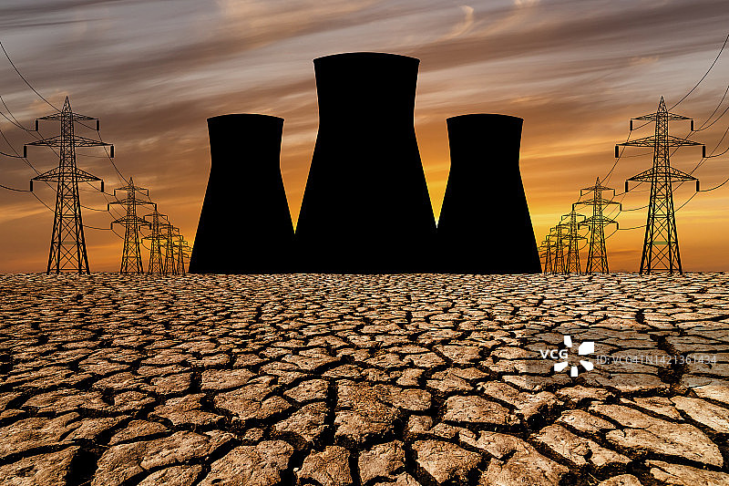 背景为龟裂地面的核电站图片素材