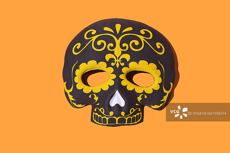 亡灵节骷髅面具，墨西哥传统，橙色背景图片素材