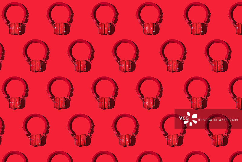 红色背景上的红色无线耳机图案图片素材