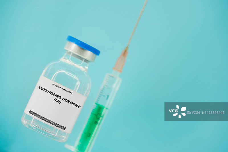注射器和促黄体激素药瓶概念图图片素材