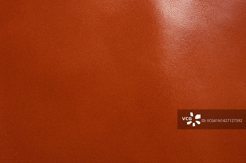 有纹理的光亮棕色皮革背景特写图片素材