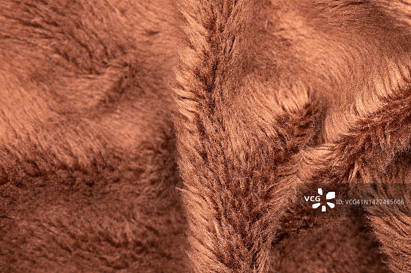 法兰绒棕色背景的宏观抽象特写纹理、纺织品图片素材