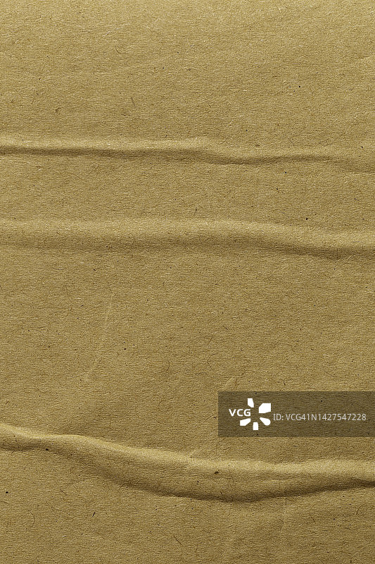 棕色纸片质地硬纸板背景。图片素材