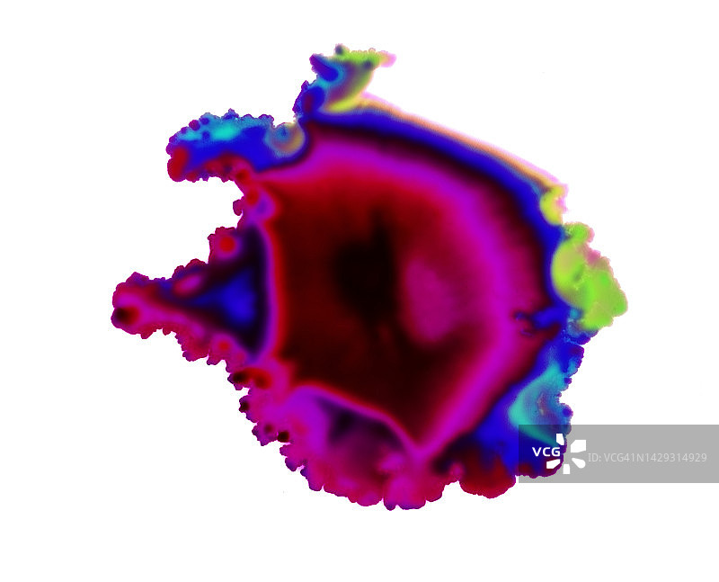 白色表面上滑落的彩色液体污渍图片素材
