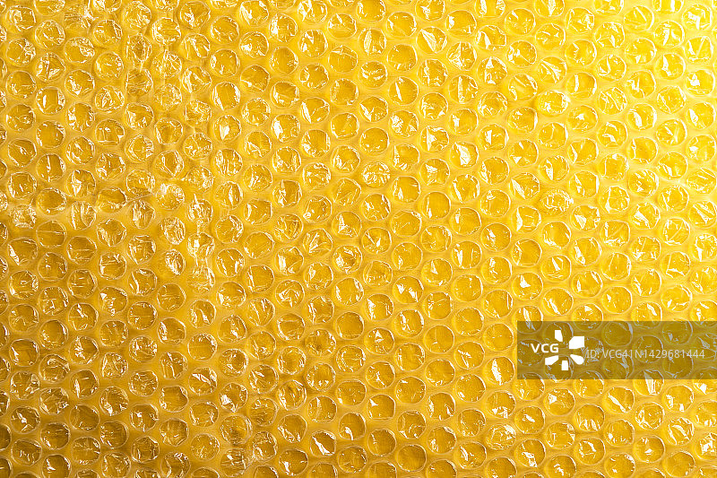 黄色气泡膜包装背景图片素材