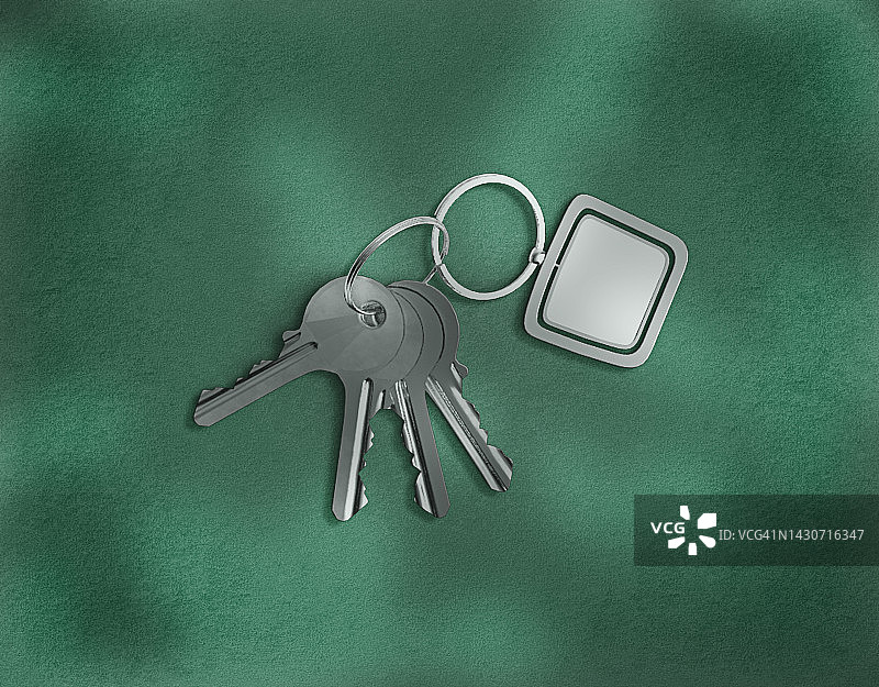 绿色表面的房屋钥匙图片素材