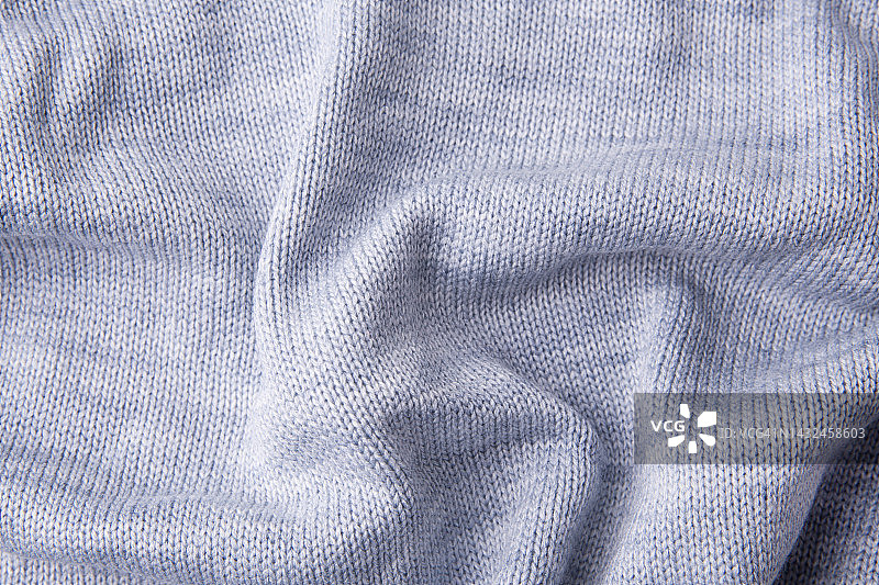 温暖的针织面料背景，羊毛物品的针织表面，温暖的冬季服装图片素材