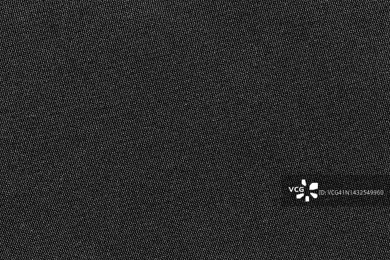 黑色面料，涤纶面料质地，纺织背景。图片素材