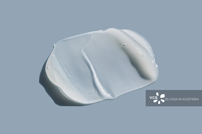 蓝色背景上的白色奶油纹理图片素材