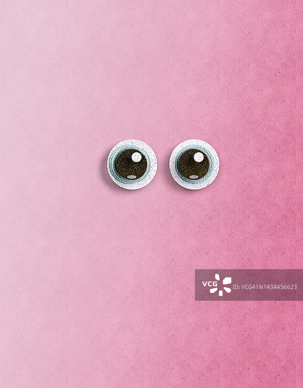 粉色背景中的卡通大眼睛图片素材