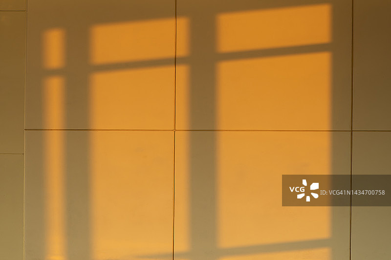 橙色混凝土墙上的影子图片素材