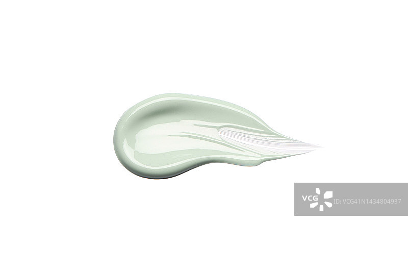 扁平构图：白色背景上的淡绿色乳霜图片素材