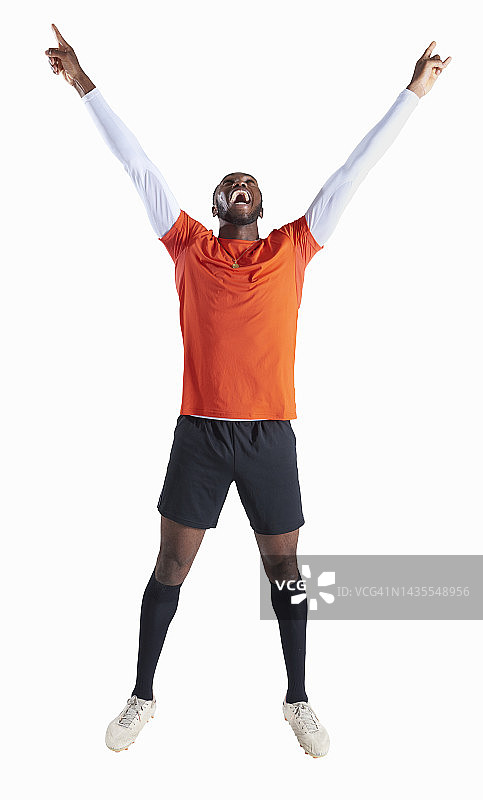 胜利姿势的足球运动员图片素材