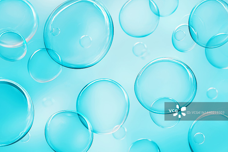 蓝色背景上的透明肥皂泡3D图案图片素材
